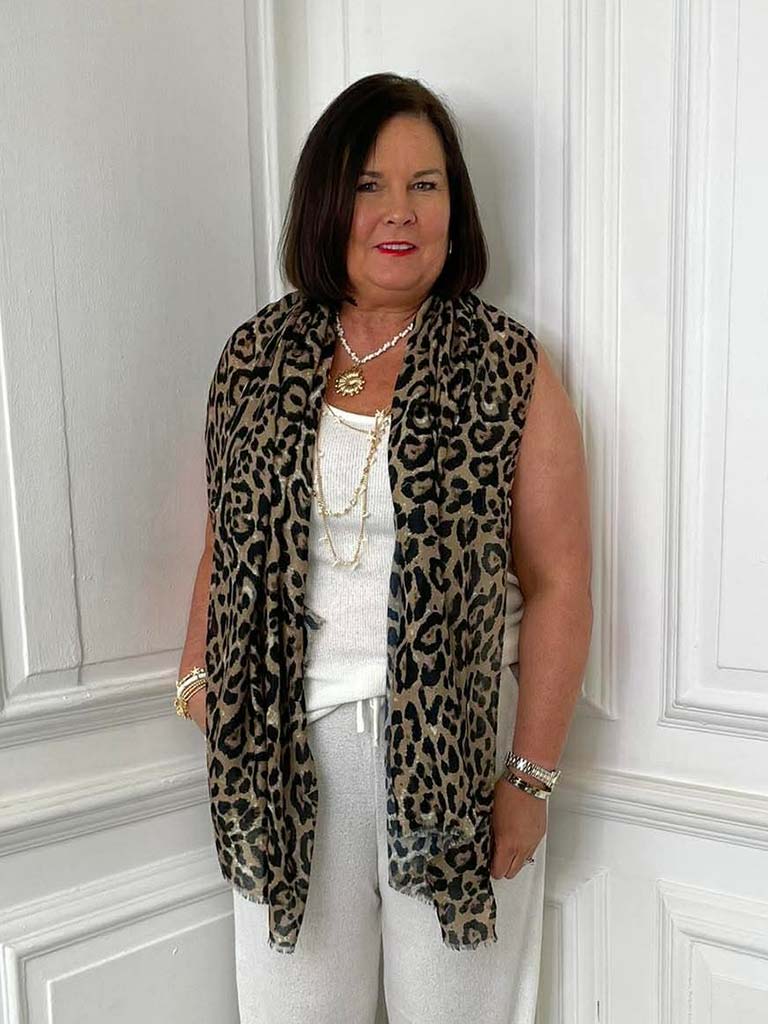 Camel leopard print scarf draped over white sleeveless top, showcasing relaxed styling for womens fashion and everyday wear. - Malissa J Leopard Print Scarf - Camel
