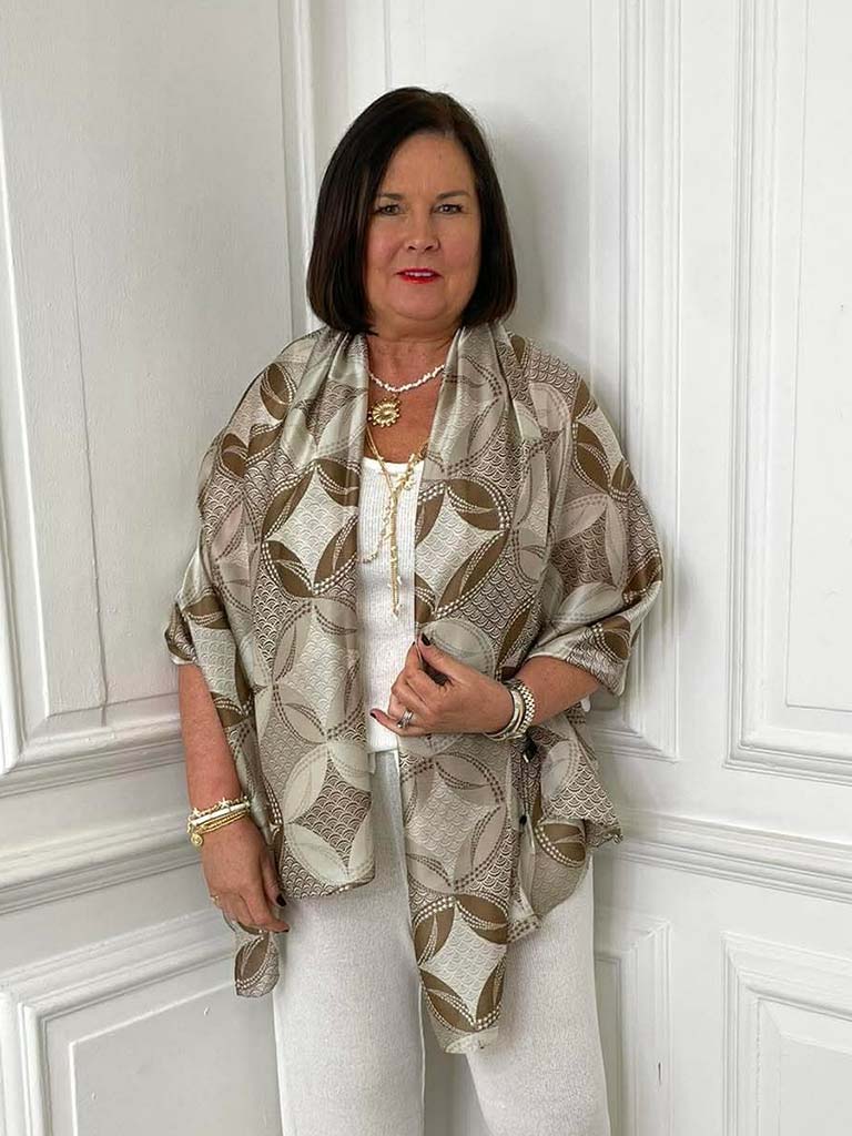 Beige Malissa J fan scarf with leaf pattern draped over white outfit, perfect for womens fashion and relaxed styling. - Malissa J Fan Scarf - Stone