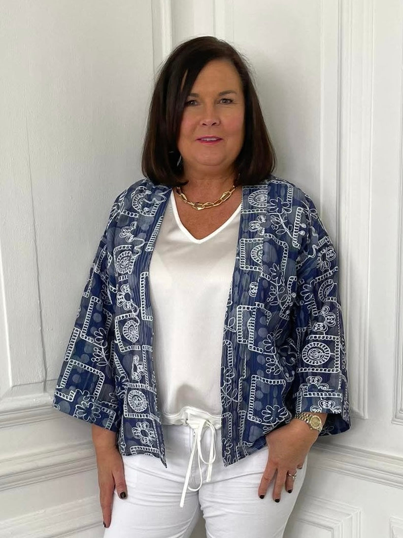 Blue daisy print short kimono with relaxed styling over white top and trousers, modern womens fashion for everyday wear. - Malissa J Daisy Print Short Kimono