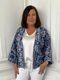 Blue daisy print short kimono with relaxed styling over white top and trousers, modern womens fashion for everyday wear. - Malissa J Daisy Print Short Kimono