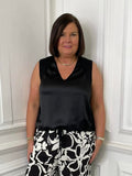 Black silk-feel drawstring vest paired with patterned trousers for relaxed, modern womens fashion everyday wear. - Malissa J Silk Feel Drawstring Vest - Black