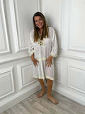 White pastel pom pom kaftan dress with relaxed styling and floral embroidery, perfect for everyday womens fashion and modern . - Pastel Pom Pom Kaftan Dress