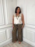 Brown leopard print wide-leg trousers with side stripe, styled with a white sleeveless top for relaxed womens fashion. - Malissa J Side Stripe Trousers - Leopard