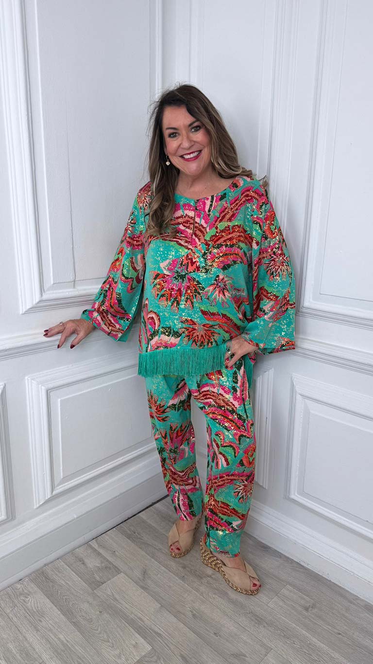 Women's green Malissa J Rio fringed top with pink and red tropical print, relaxed styling for everyday wear in modern outfit. - Malissa J Rio Fringed Top - Jade