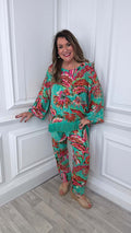 Women's green Malissa J Rio fringed top with pink and red tropical print, relaxed styling for everyday wear in modern outfit. - Malissa J Rio Fringed Top - Jade
