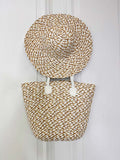 Two-piece women's straw bag and matching wide-brim hat in beige, ideal for everyday wear and relaxed styling with a modern. - Malissa J Two Piece Straw Bag & Hat - Stone