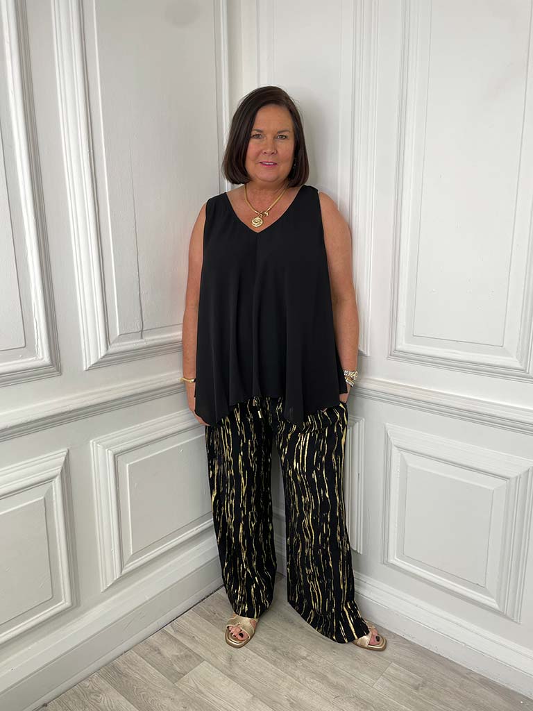 Black metallic shimmer relaxed-fit trousers styled for modern womens fashion and everyday wear. - Malissa J Metallic Shimmer Trousers - Black