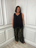 Black metallic shimmer relaxed-fit trousers styled for modern womens fashion and everyday wear. - Malissa J Metallic Shimmer Trousers - Black