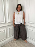 Brown bubble hem trousers paired with white sleeveless top for relaxed womens fashion everyday wear and modern outfit. - Bubble Hem Trousers - Chocolate
