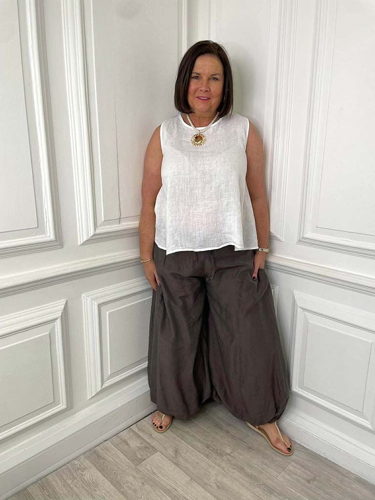 Brown bubble hem trousers paired with white sleeveless top for relaxed womens fashion everyday wear and modern outfit. - Bubble Hem Trousers - Chocolate