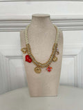 Gold rope charm necklace with floral and heart pendants for relaxed styling and everyday wear. - Rope Charm Necklace